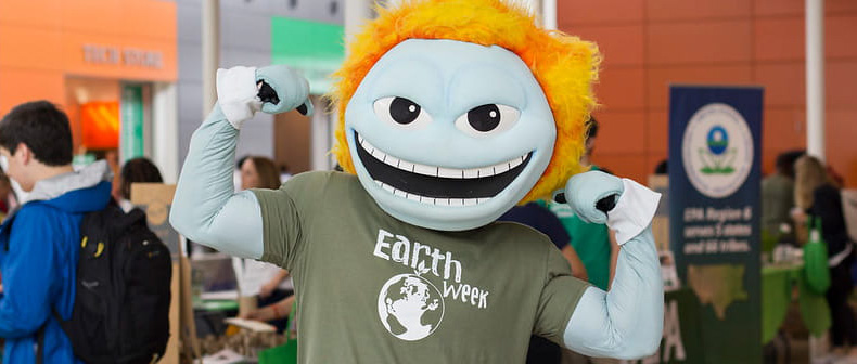 UT Dallas Mascot Temoc with an Earth Week shirt